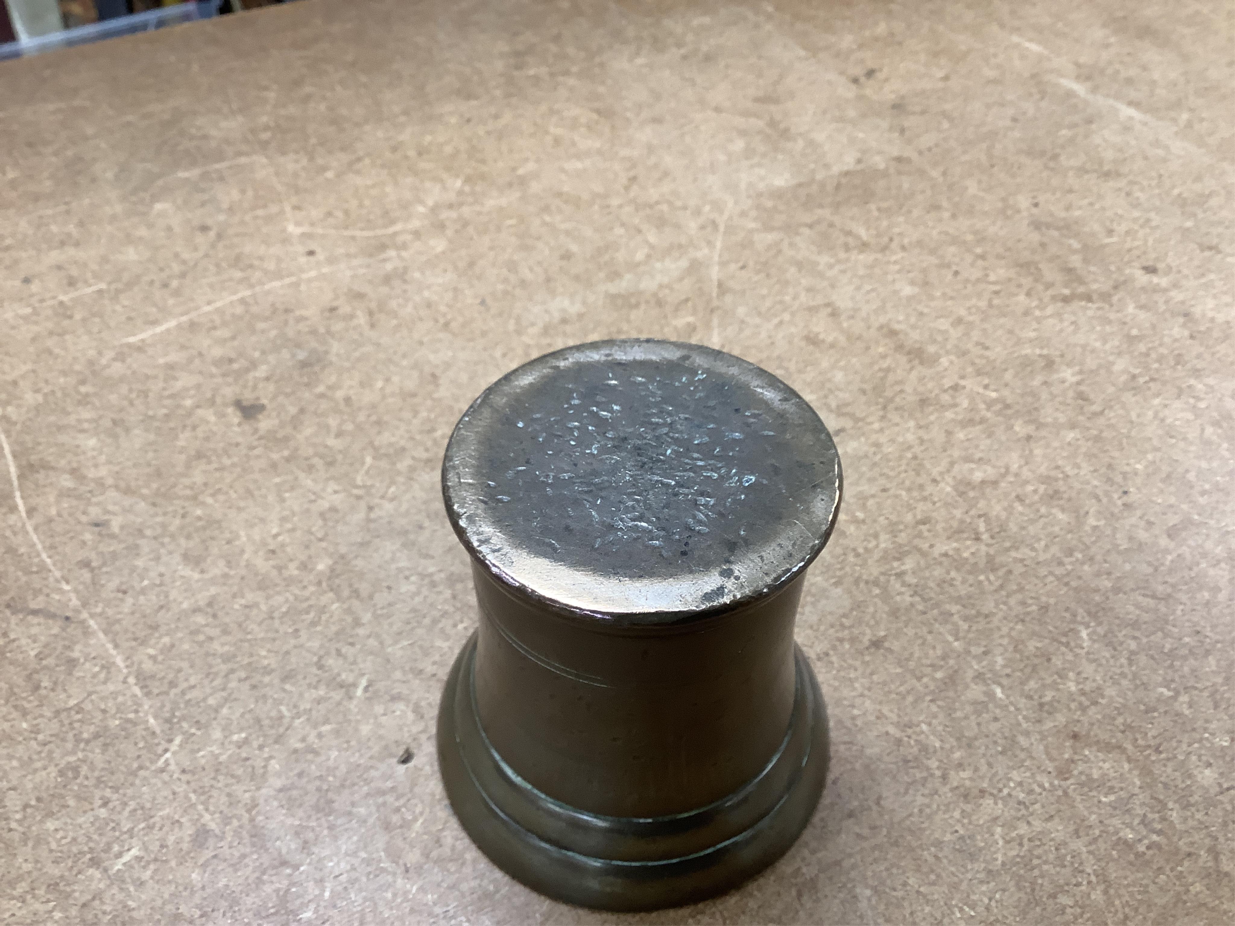 Sundry items to include a large pestle, spice grinder, flat iron on stand, bronze mortar and three other items, largest 42cm in length